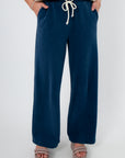 Z Supply Indigo Hunter Knit Denim Pant in soft knit blue fabric with drawstring waist and relaxed jogger fit, ideal for lounge or travel wear.