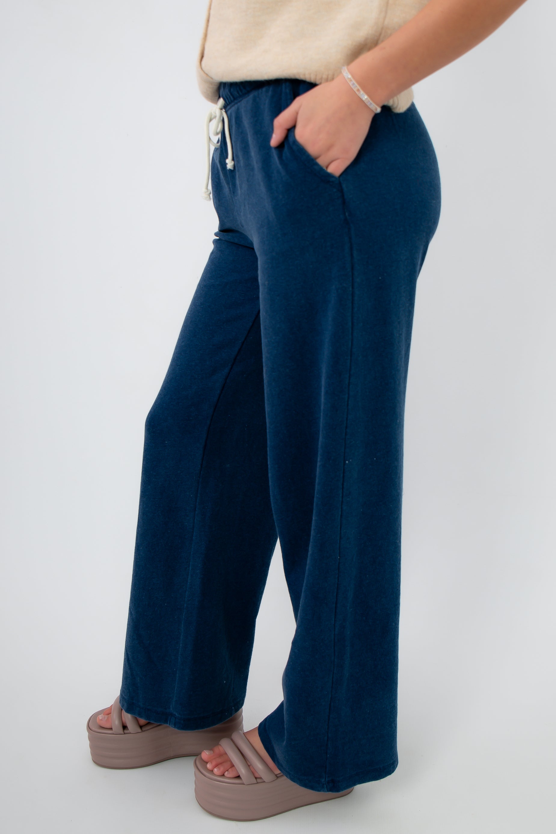 Side view of Z Supply Indigo Hunter Knit Denim Pant showing wide-leg silhouette and cozy knit texture in indigo blue for casual comfort.