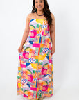 Colorful abstract summer dress with strapless design, palm trees, and beach scene print