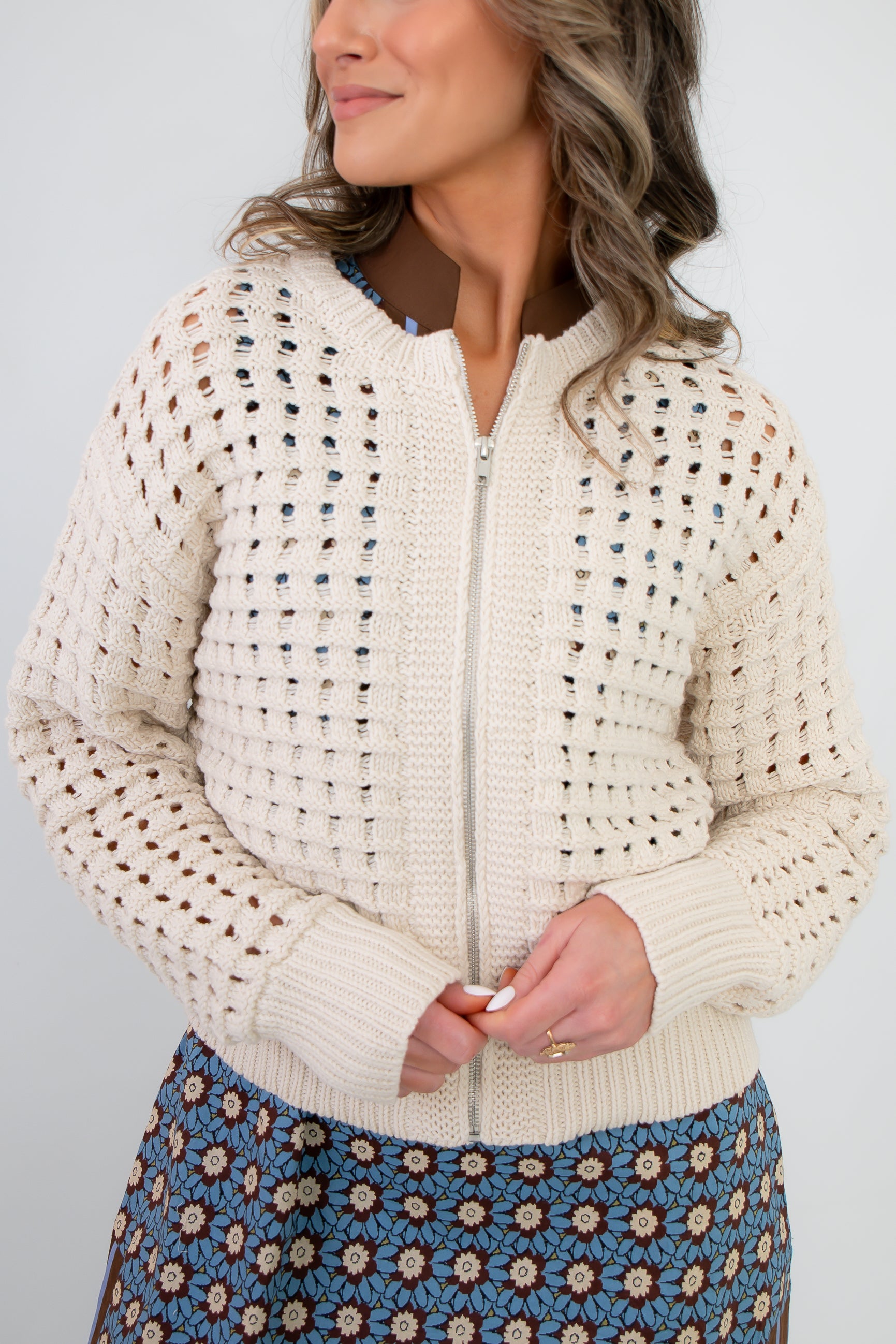 Close-up of Z Supply Crystal Logan Sweater Jacket showing textured open-knit design and front zipper. Ideal for versatile spring outerwear styling.