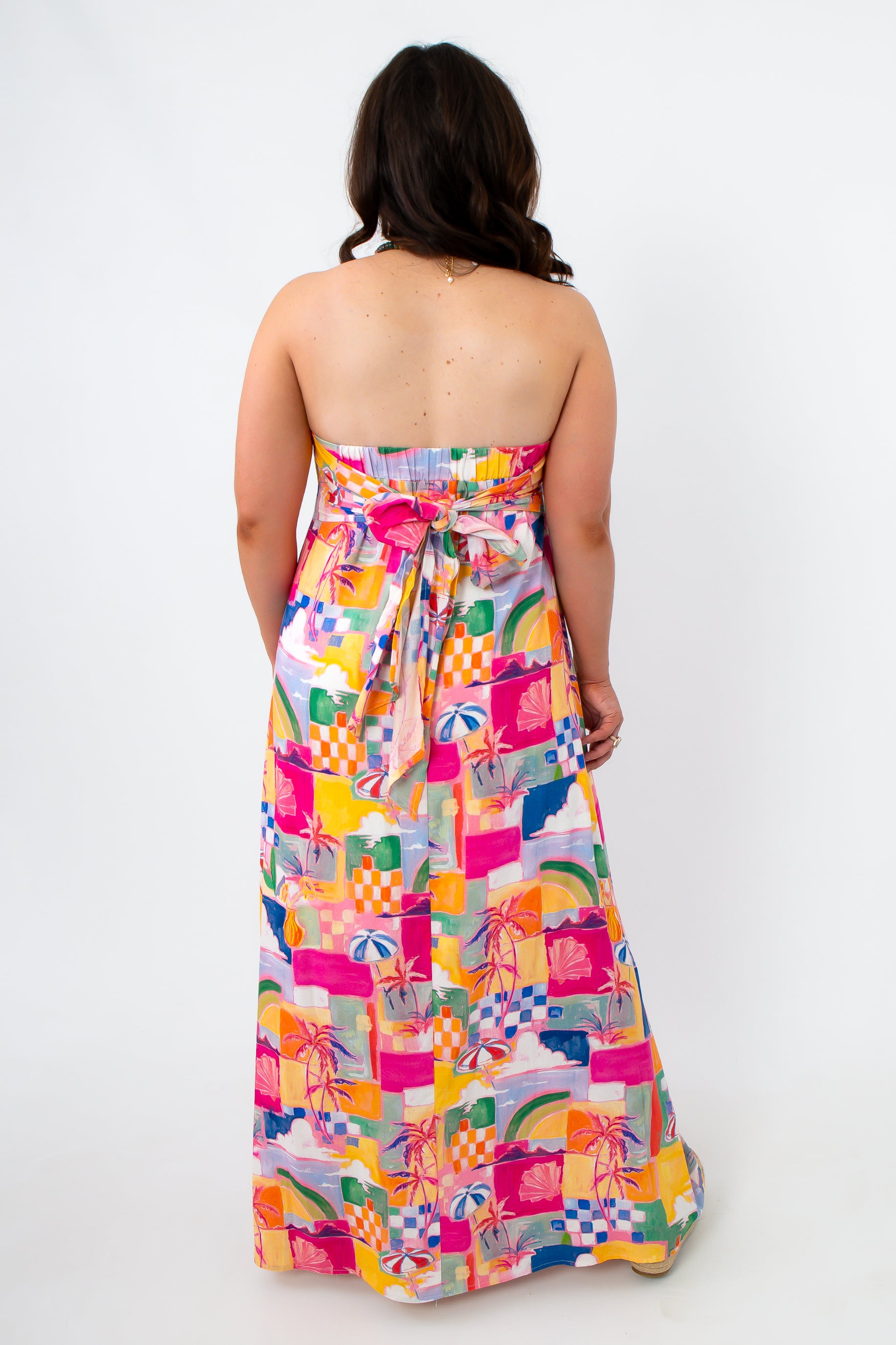 Colorful abstract summer dress with strapless design and tie back