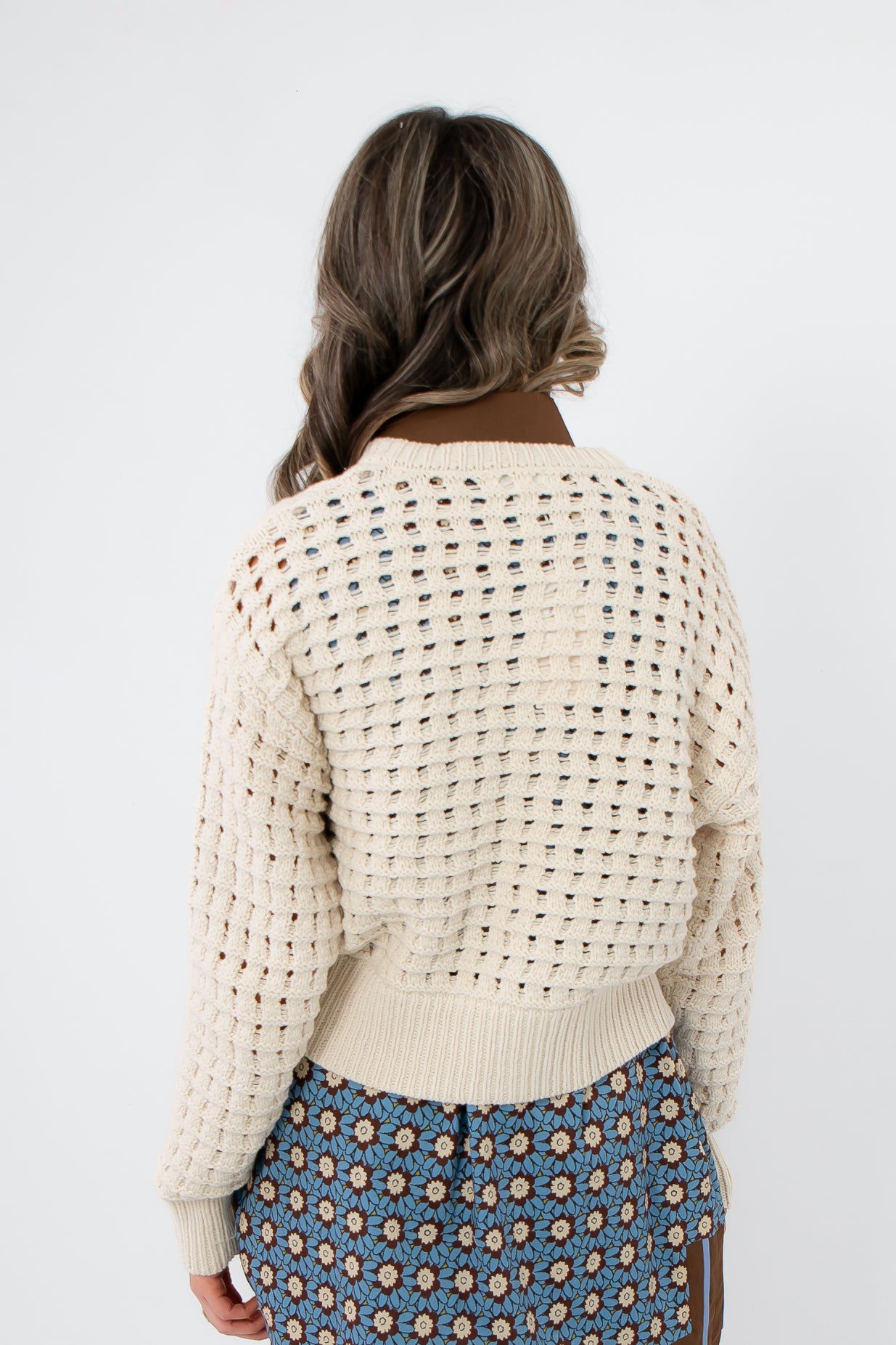 Back view of Z Supply Crystal Logan Sweater Jacket featuring open-knit pattern and relaxed fit. Lightweight outerwear for stylish spring outfits.