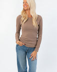 Roxi Ribbed Knit Top in clay taupe with long sleeves and fitted silhouette, styled with casual denim for a boutique fall layering look.