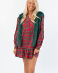 Frosted Pine Green Faux Fur Vest styled over a red plaid holiday dress, perfect for boutique winter fashion and festive layering.