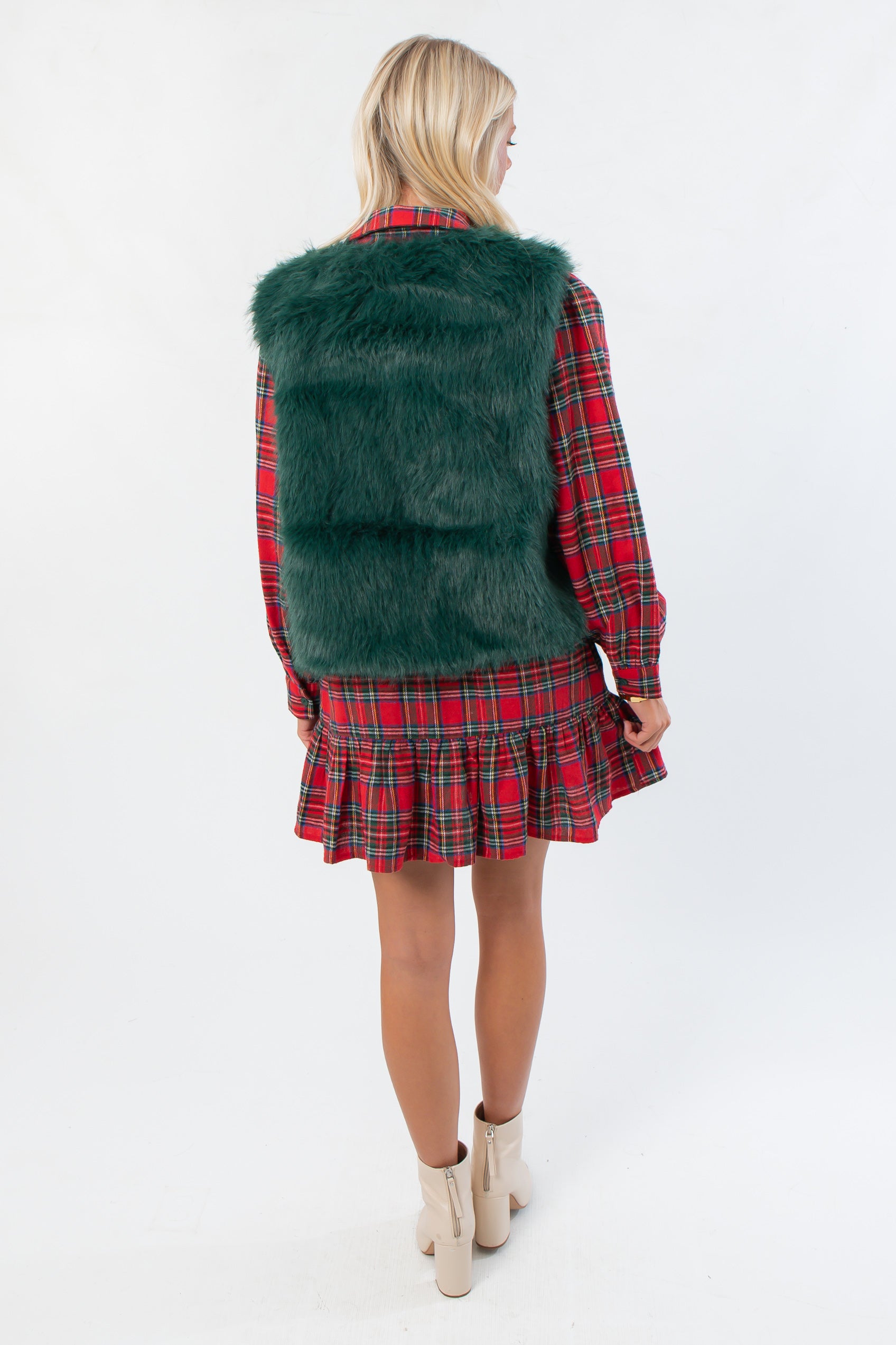 Back view of Frosted Pine Green Faux Fur Vest highlighting plush texture and boutique winter style in festive holiday fashion.