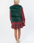 Back view of Frosted Pine Green Faux Fur Vest highlighting plush texture and boutique winter style in festive holiday fashion.