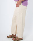 Side view of Sea Salt Ecru Cropped Wide Leg Jean showing wide leg silhouette and soft stretch denim fabric for a slim fit.