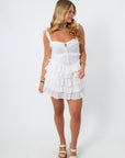Side view of white voile Lucia romper with layered ruffles for summer fashion