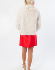Back view of Winter Wonderland Ivory Faux Fur Jacket showing full faux fur coverage. Perfect boutique outerwear for cold weather and holiday fashion.