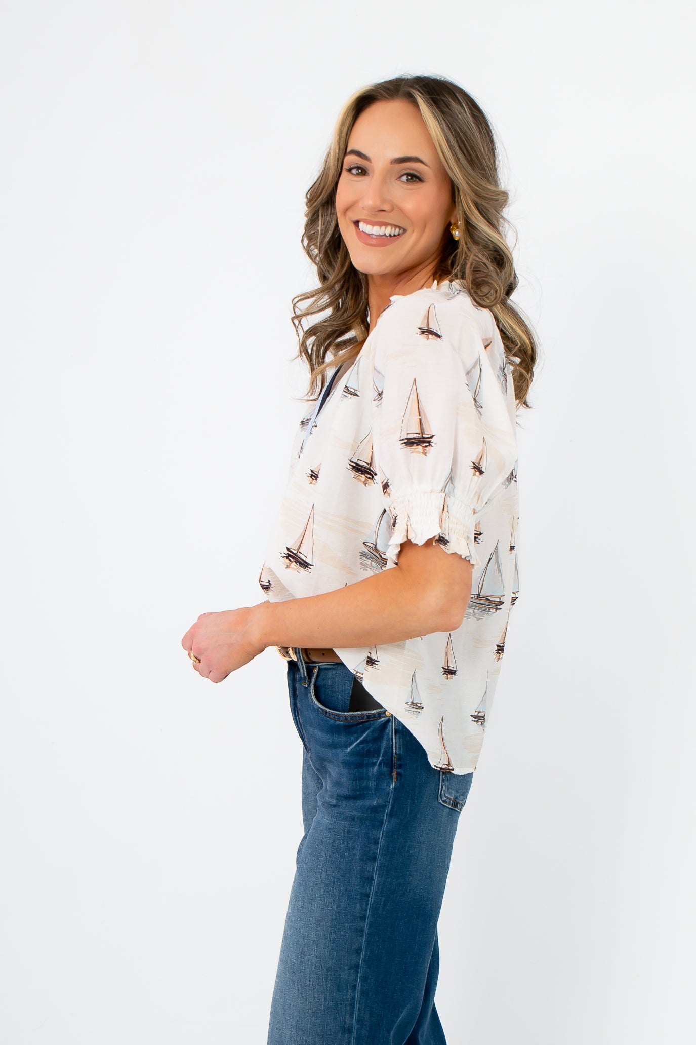 Side view of THML Sailboat Short Sleeve Blouse showing relaxed fit and breezy fabric ideal for warm weather.