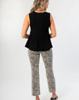 Back view of Black Flared Rib Knit Top showcasing its ribbed knit texture and flared hem, ideal for casual or dressy outfits.