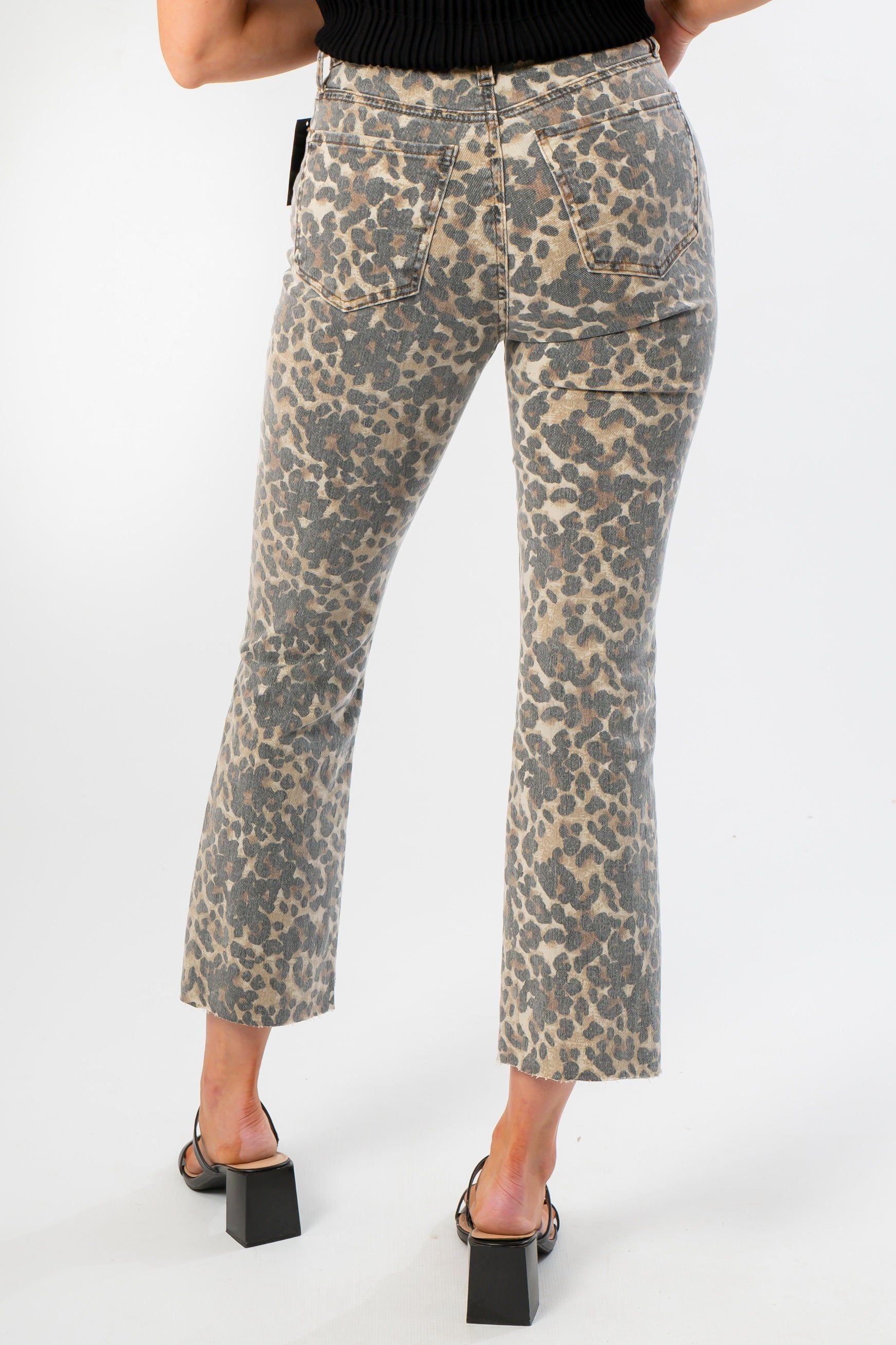 Back view of Kut Kelsey High Rise Leopard Pants showing rear pockets, ankle flare cut, and all-over animal print for a bold fashion statement.