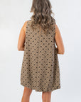 Back view of Upper East Glen Plaid Bow Bubble Hem Mini Dress highlighting its relaxed fit and elegant fall plaid design for seasonal glam looks.
