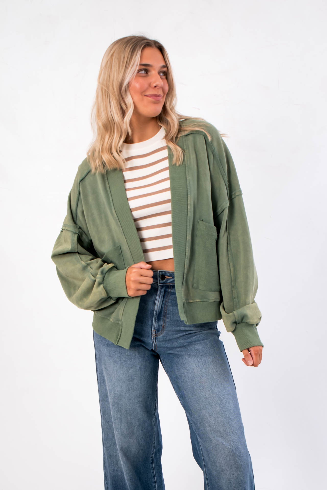 Weekend Moves Frosted Sage Terry Lounge Cardigan styled open over a striped crop top and wide-leg jeans, perfect cozy fall outerwear.