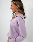Back view of lavender zip sweatshirt, relaxed fit