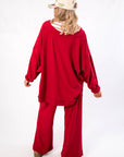 Free People Deep Cherry Staycation Pullover – Back view of oversized cherry red sweatshirt with relaxed hem and soft fabric, perfect for lounging.
