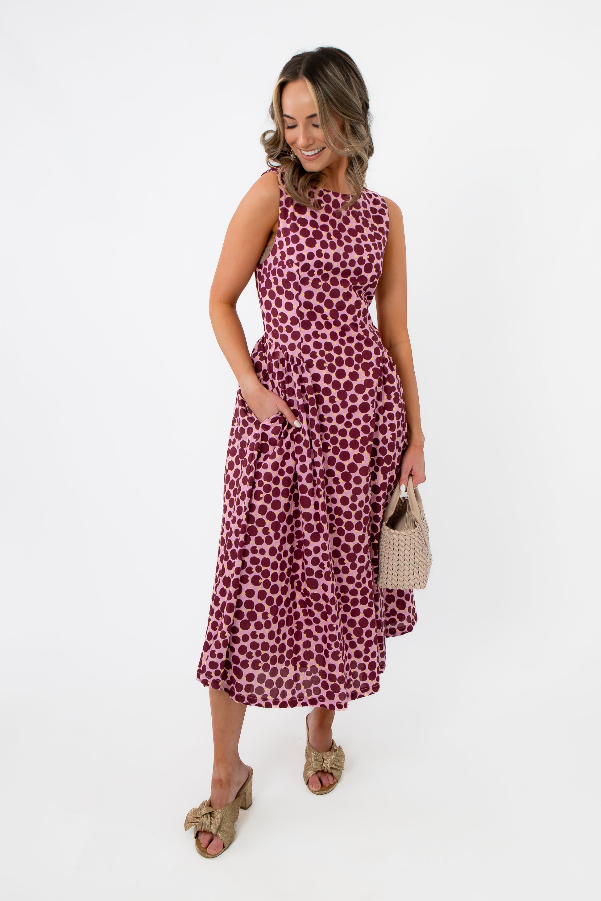 THML Tini Pink Polka Dot Midi Dress – Stylish Summer Dress with sleeveless design, fitted bodice, and flared skirt, ideal for warm-weather events.