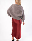 Back view of 'Tis The Season Charcoal Sweater | Cozy Holiday Pullover for Women highlighting ribbed hem and plush knit fabric for winter comfort.