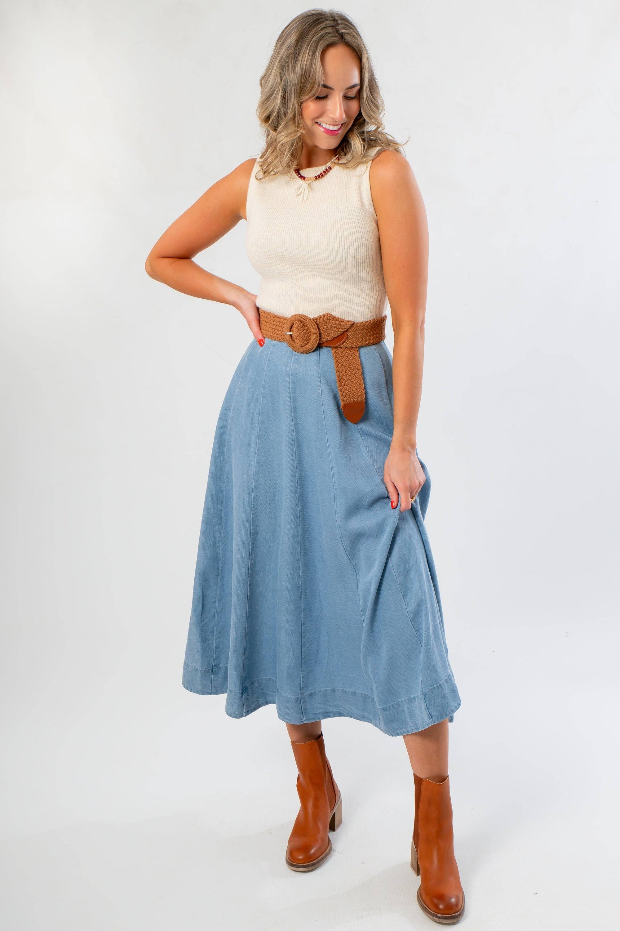 Washed Denim Paneled Midi Skirt styled with a sleeveless knit top and brown belt, perfect for fall fashion with boots.
