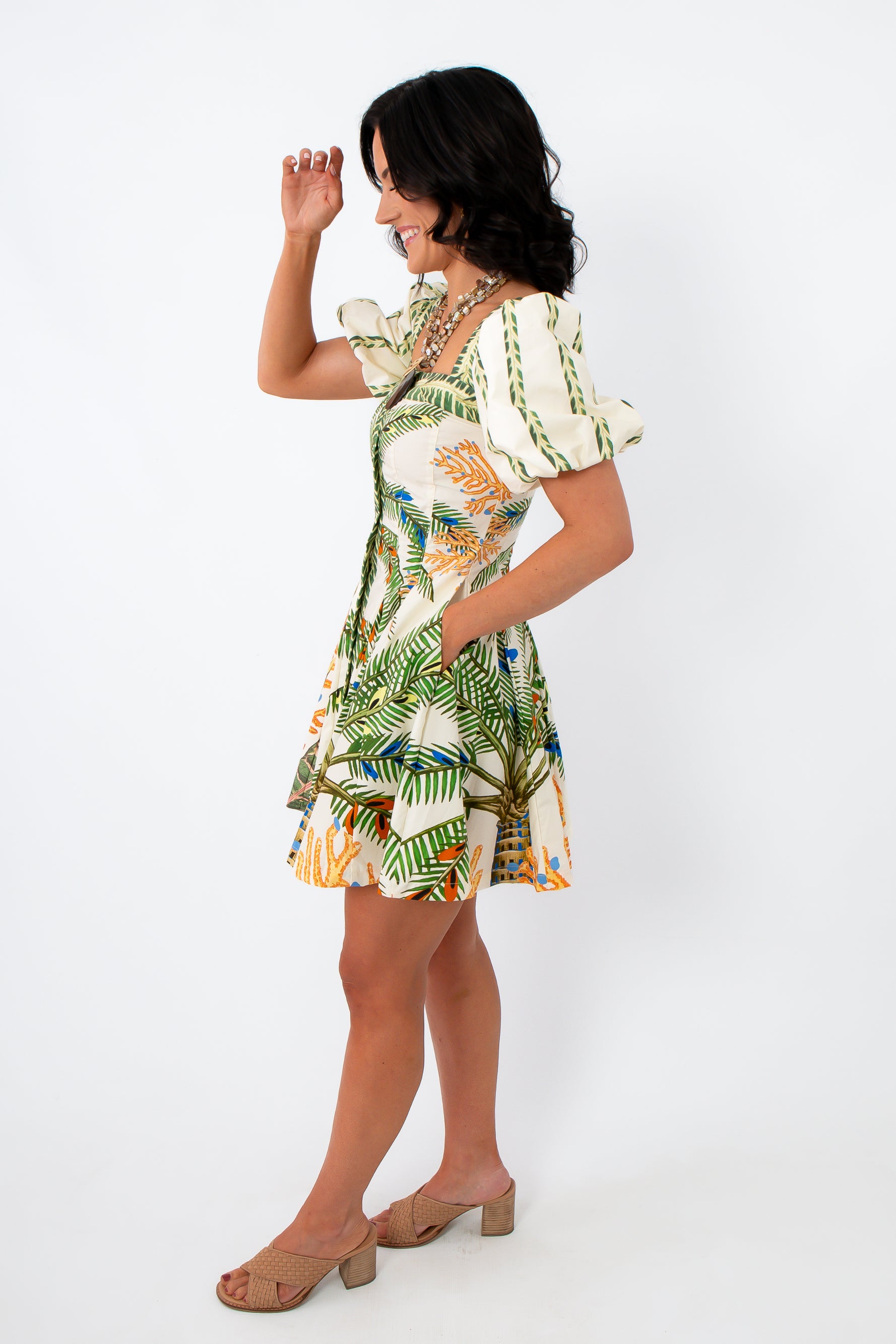 Back view of tropical palm print puff sleeve mini dress for summer