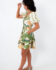 Back view of tropical palm print puff sleeve mini dress for summer