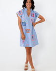 Blue gingham embroidered dress with colorful patchwork details, ruffled sleeves, and lightweight fabric for summer wear