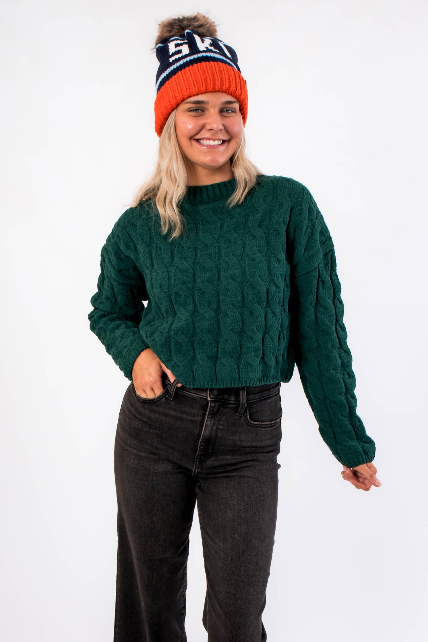 Tree Farm Stroll Cable-Knit Sweater in forest green with chunky knit texture and relaxed fit, styled with black jeans for a cozy holiday look.