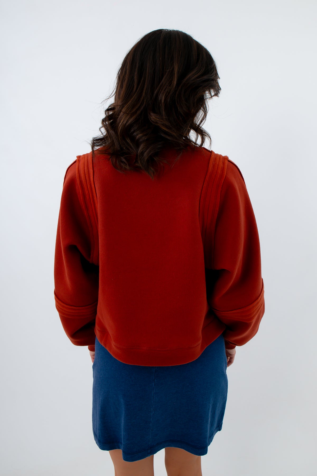 Mahogany sweatshirt, red-orange sweatshirt with textured detailing, mahogany sweatshirt with seam detailing