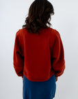 Mahogany sweatshirt, red-orange sweatshirt with textured detailing, mahogany sweatshirt with seam detailing