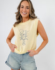 Buttery yellow lobster embroidered sleeveless sweater styled with denim shorts. A coastal knit top perfect for summer layering and beach outings.