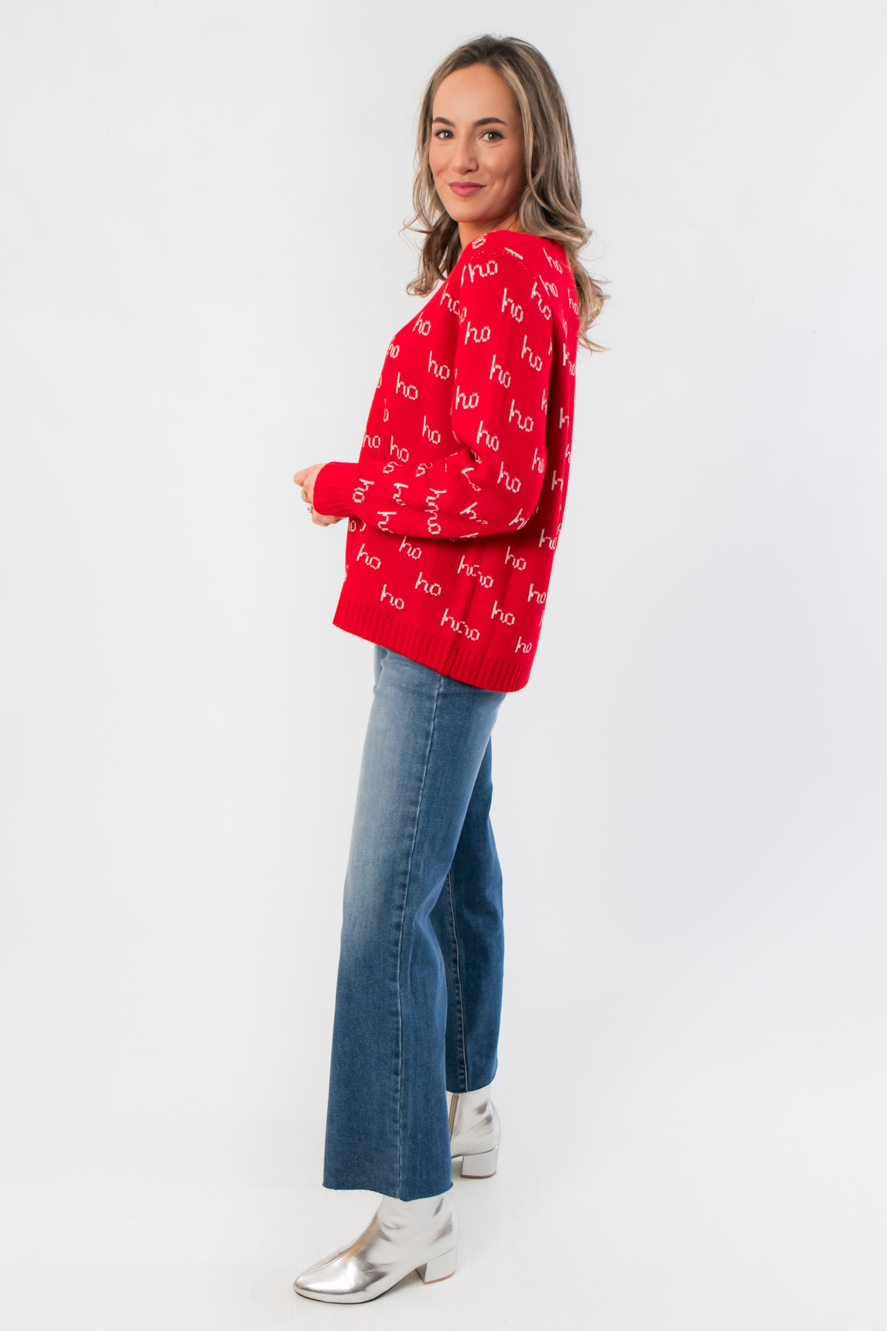 Side view of Ho Ho Ho-liday Cheer Red Christmas Sweater showing relaxed fit and festive knit design, perfect for holiday events.