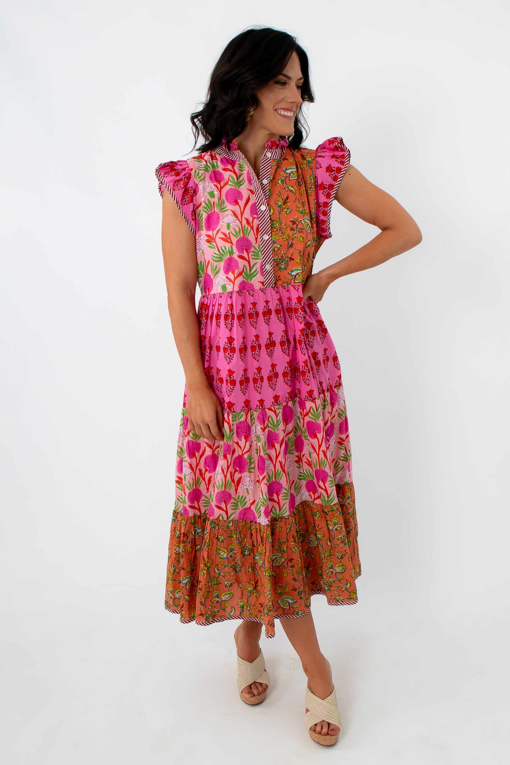 Side view of vibrant patchwork midi dress with floral and geometric prints