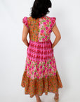 Colorful patchwork tiered midi dress with floral and geometric patterns