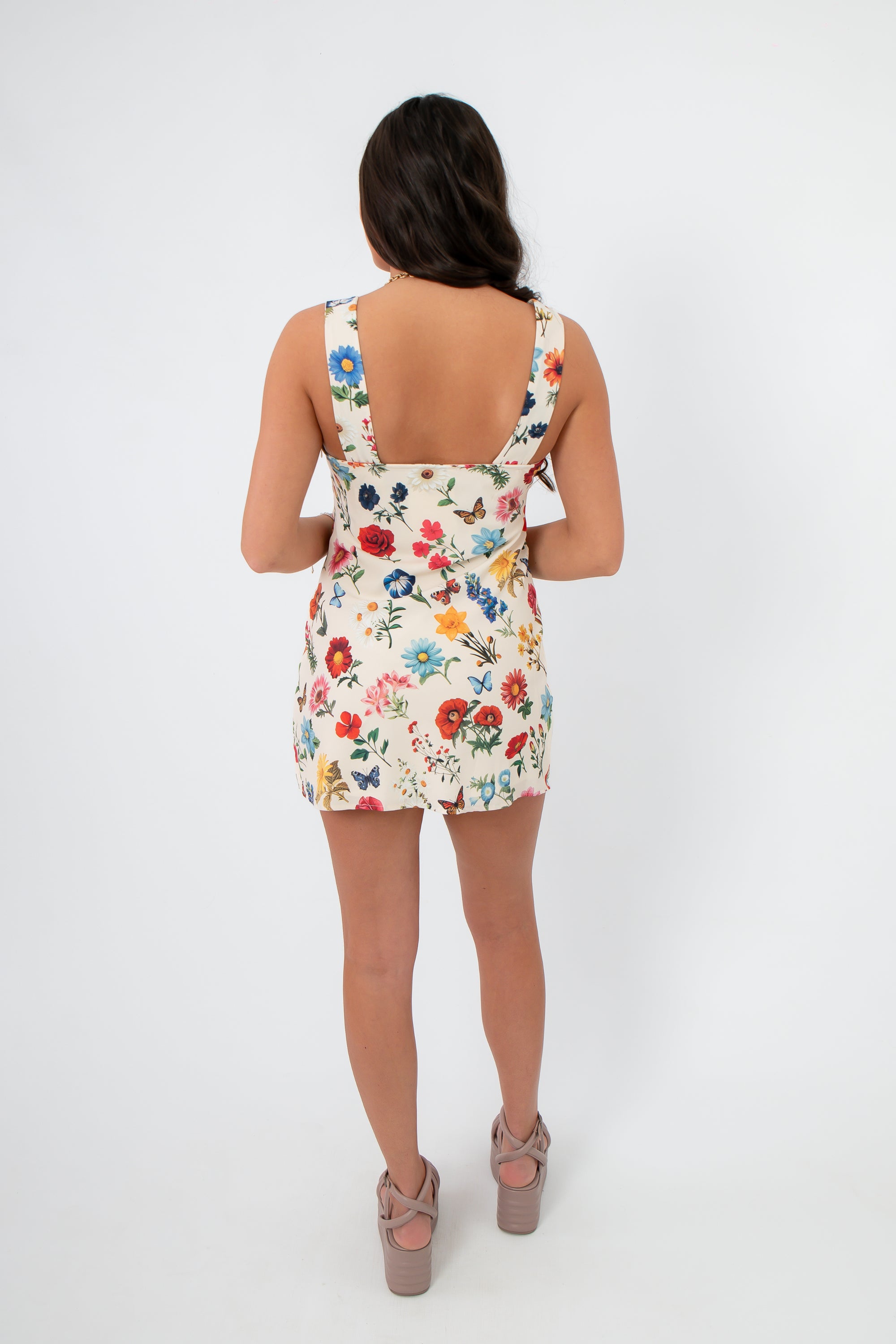 Back view of the Show Me Your Mumu French Floral Emily Mini Dress with a low scoop back and fitted silhouette, ideal for spring events.