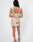 Back view of the Show Me Your Mumu French Floral Emily Mini Dress with a low scoop back and fitted silhouette, ideal for spring events.