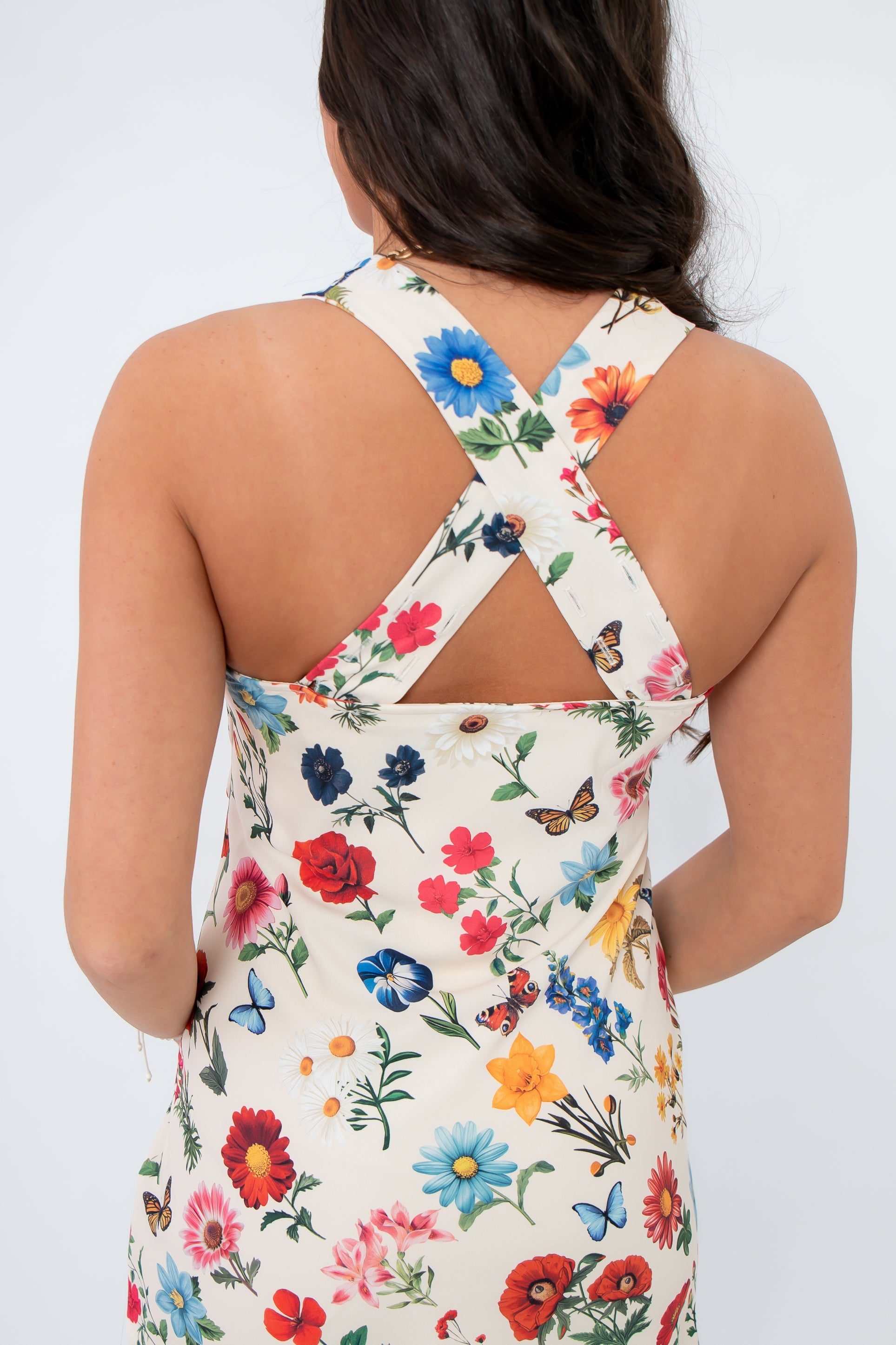 Detail of the crisscross back straps on the Show Me Your Mumu French Floral Emily Mini Dress, adding a stylish twist to the floral mini design.