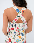 Detail of the crisscross back straps on the Show Me Your Mumu French Floral Emily Mini Dress, adding a stylish twist to the floral mini design.