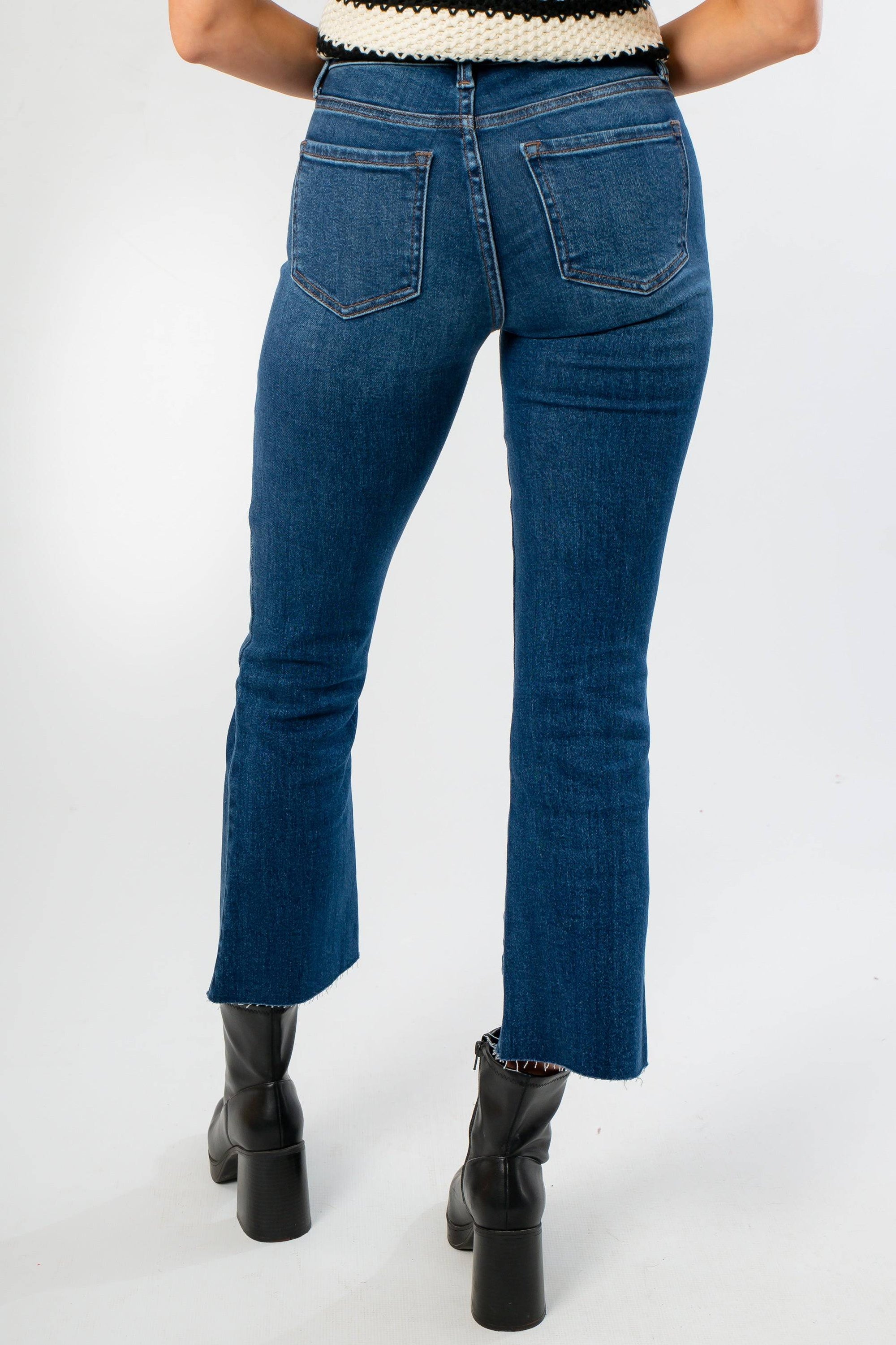 Back view of On The Daily Dark Wash Crop Flare Jeans showcasing flattering pocket placement and cropped flare cut.