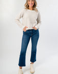 Taupe Stripe Long Sleeve Sweater with crew neck and relaxed fit, styled with cropped jeans and cream boots for a cozy fall look.