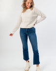 Cozy Taupe Stripe Long Sleeve Sweater paired with denim and neutral boots, perfect for stylish everyday wear in cooler seasons.