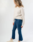 Side view of Taupe Stripe Long Sleeve Sweater showcasing its soft knit texture and casual fit, ideal for pre-fall layering.