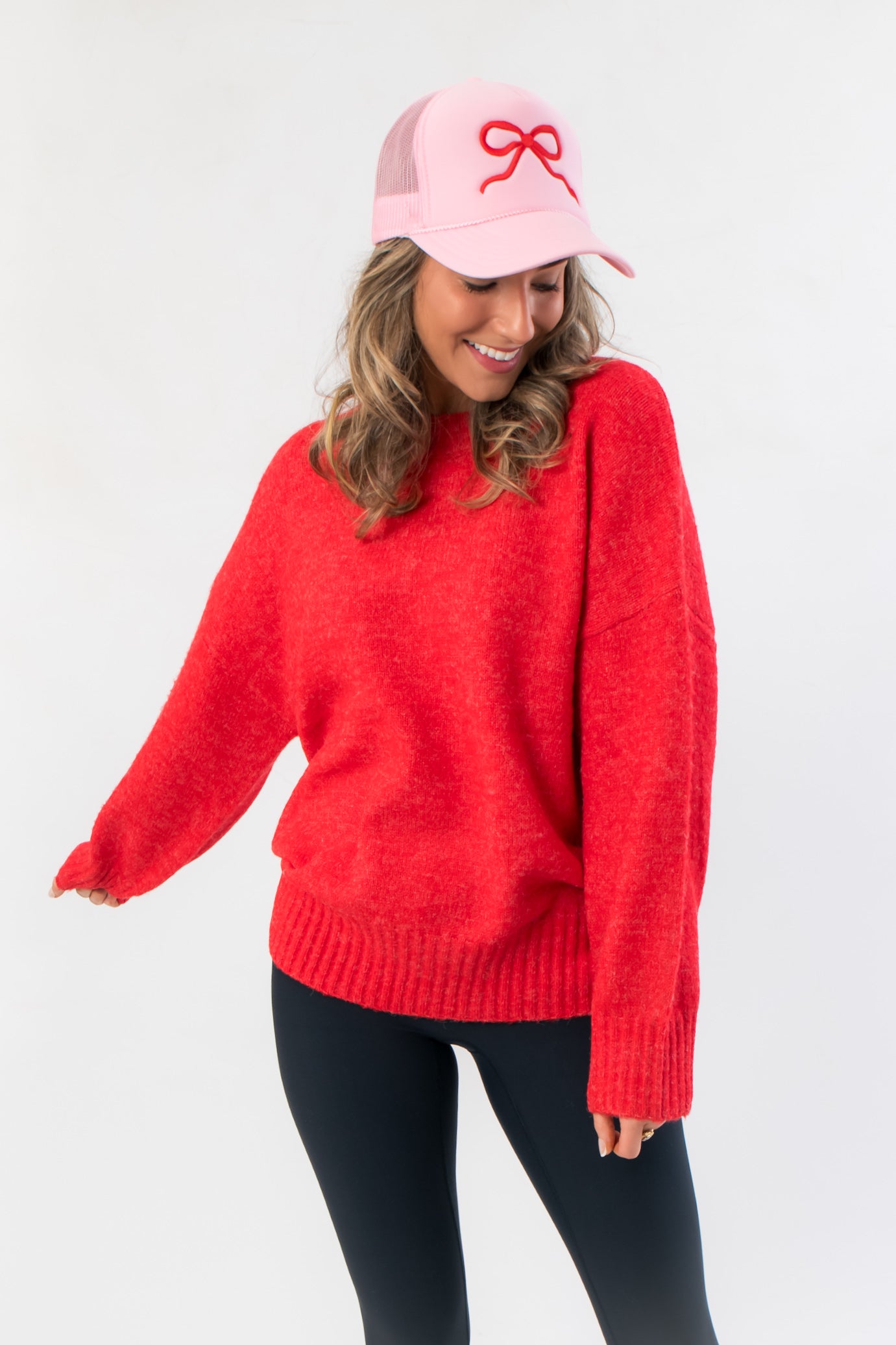 Close-up of Candied Cherry Red Knit Sweater showcasing its soft texture and relaxed fit, a must-have top for winter fashion lovers.