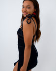 Fall denim dress in dark wash, with adjustable tie straps for game day look