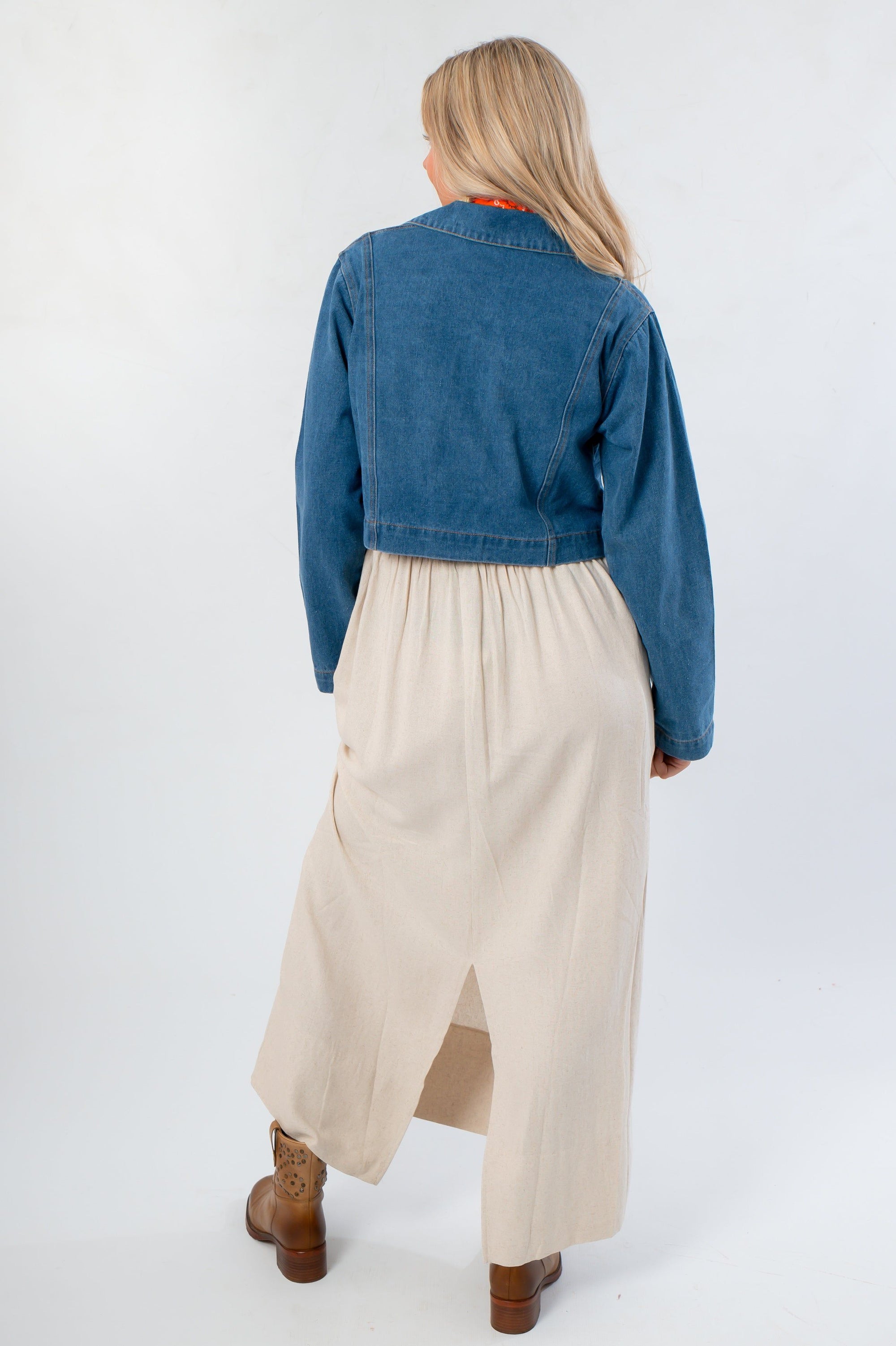 Back view of Denim Long Sleeve Top - Wide Open Layering paired with flowy cream skirt. Lightweight and stylish for fall layering.