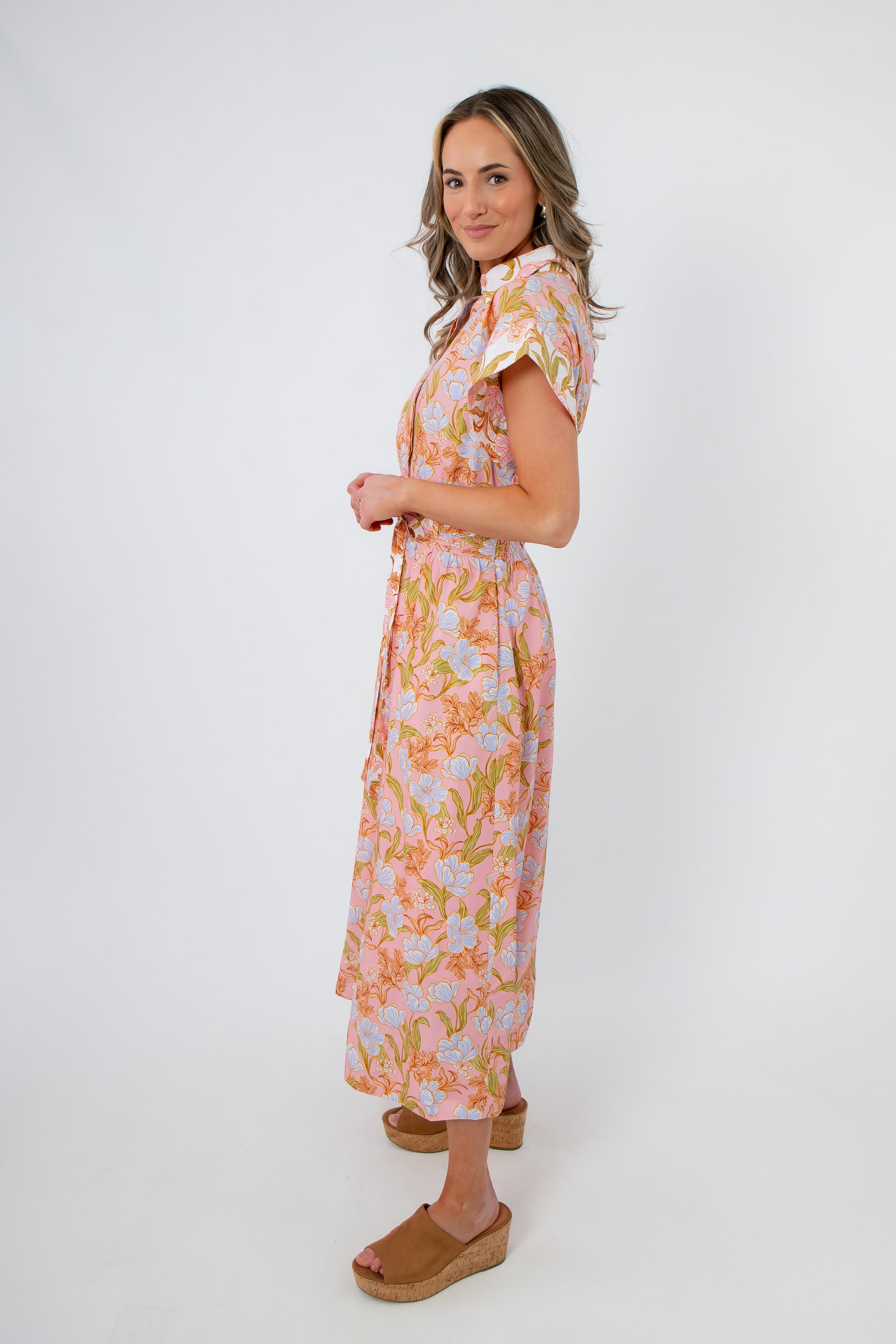 Side view of Coral Gables Floral Midi Shirt Dress highlighting its flowy silhouette, cap sleeves, and breathable fabric for warm weather.