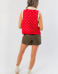 Back view of Clara Collared Knit Sweater Vest highlighting red knit pattern with cream accents, perfect for stylish seasonal outerwear looks.