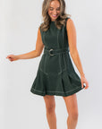 Sleeveless Charlie Evergreen Mini Dress featuring a belted A-line silhouette and pleated hem, perfect for holiday gatherings or casual parties.