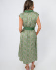 Back view of Emerald Deco Printed Satin Midi Dress featuring green Art Deco pattern and wide satin waistband. Ideal for weddings and summer parties.