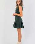 Side view of Charlie Belted A-Line Evergreen Mini Dress showing flared skirt and tailored fit, ideal for festive and casual wear.
