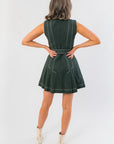 Back view of Charlie Evergreen Mini Dress with belted waist and contrast stitching, highlighting its flattering A-line cut for holiday occasions.